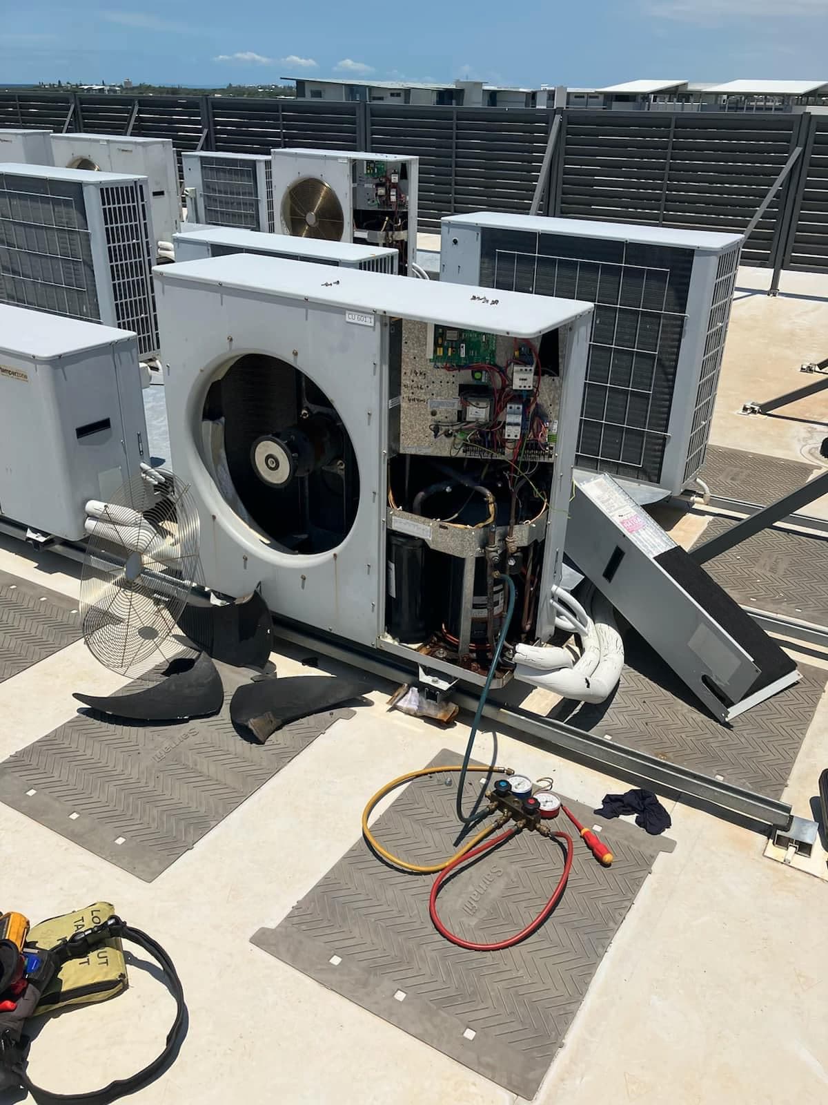 On Point Air technician servicing a commercial air conditioning unit
