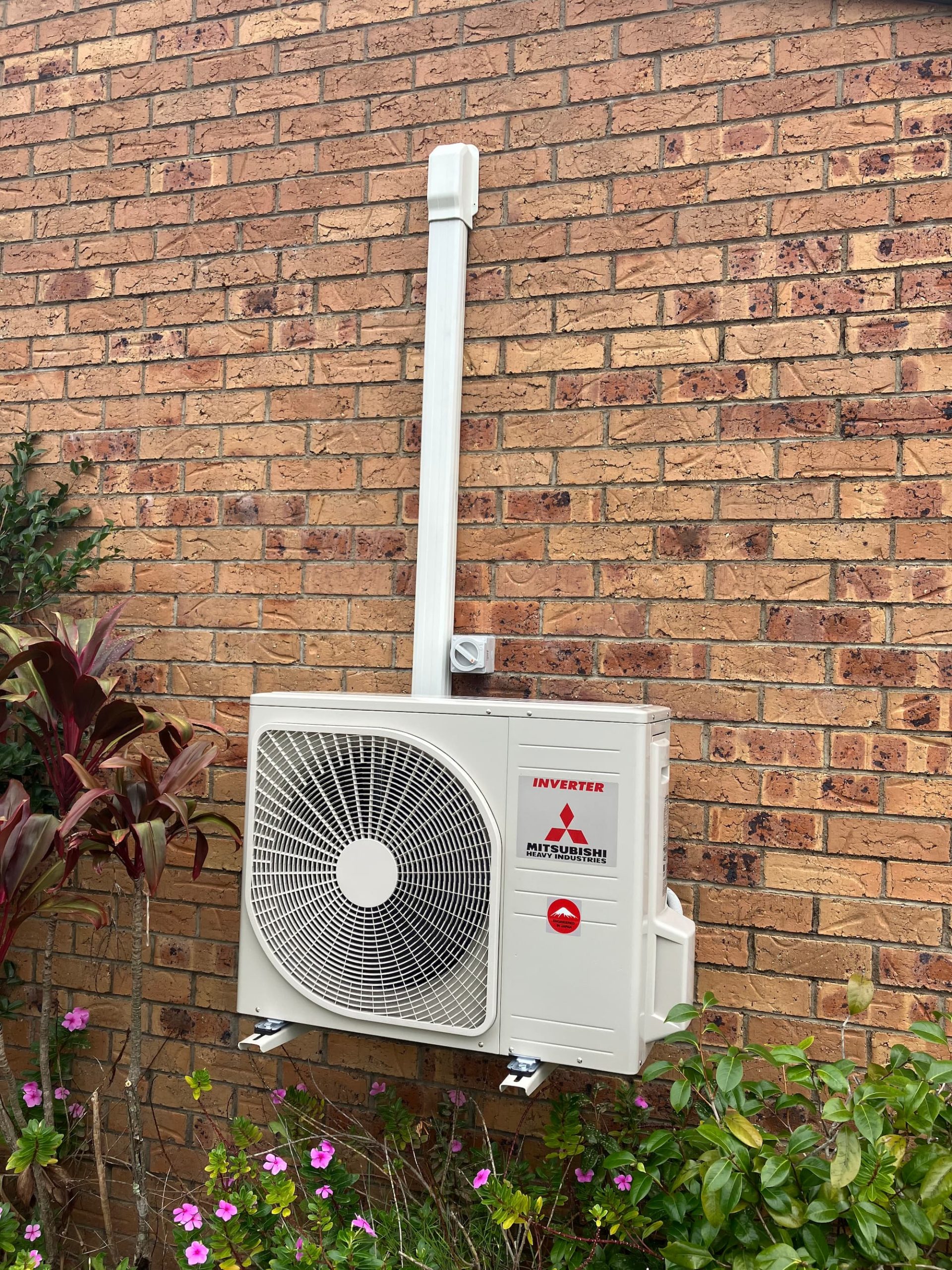 On Point Air technician installing a residential air conditioning system