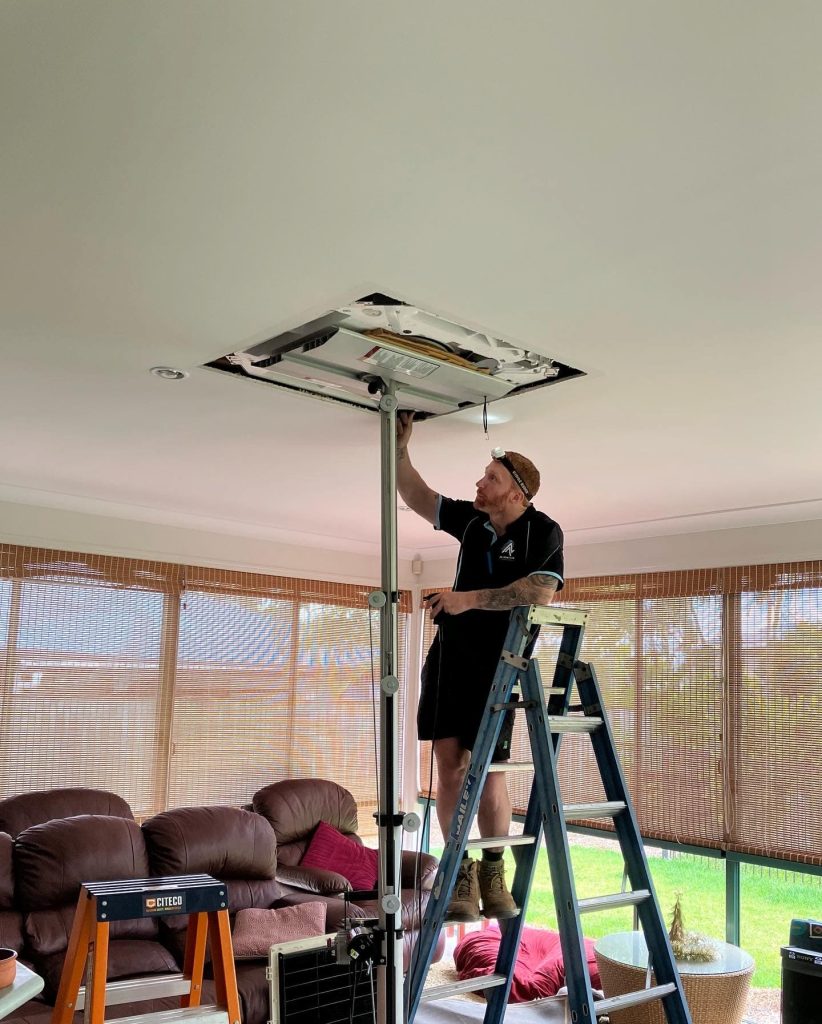 Dane and Mark's team at work installing ducted air conditioning